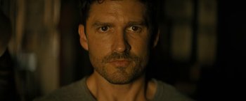 Movie still from “Knock at the Cabin” (2023), directed by M. Night Shyamalan – A person with a beard; Close Up shot, Low angle