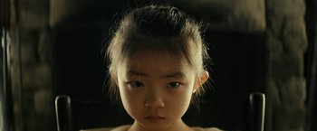 Movie still from “Knock at the Cabin” (2023), directed by M. Night Shyamalan – A little girl with a very long hair; Close Up shot, High angle