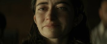 Movie still from “Knock at the Cabin” (2023), directed by M. Night Shyamalan – A woman's face in the dark; Close Up shot, Low angle