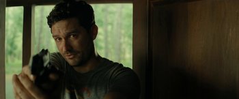 Movie still from “Knock at the Cabin” (2023), directed by M. Night Shyamalan – A person in a room near a window; Close Up shot, Over the shoulder angle