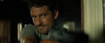 Movie still from “Knock at the Cabin” (2023), directed by M. Night Shyamalan – A person looking at the camera; Close Up shot, Over the shoulder angle