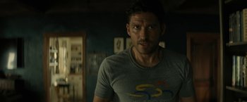 Movie still from “Knock at the Cabin” (2023), directed by M. Night Shyamalan – A person wearing a shirt; Close Up shot, Over the shoulder angle