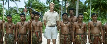Movie still from “Kon-Tiki” (2012), directed by Espen Sandberg – A group of men standing next to each other on a dirt path; Wide shot, Low angle