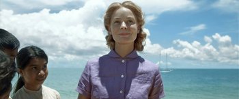 Movie still from “Kon-Tiki” (2012), directed by Espen Sandberg – A woman standing in front of a body of water; Close Up shot, Low angle