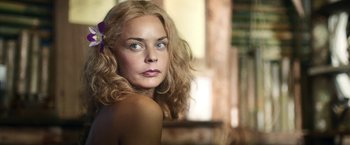 Movie still from “Kon-Tiki” (2012), directed by Espen Sandberg – A beautiful woman with blonde hair and blue eyes; Close Up shot, Low angle