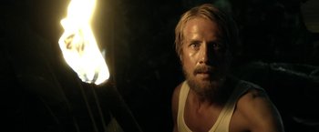 Movie still from “Kon-Tiki” (2012), directed by Espen Sandberg – A man with long hair and a beard is looking at the camera; Close Up shot, Over the shoulder angle
