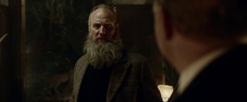Movie still from “Kon-Tiki” (2012), directed by Espen Sandberg – An old man with a long beard looking into a mirror; Close Up shot, Over the shoulder angle