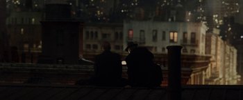 Movie still from “Kon-Tiki” (2012), directed by Espen Sandberg – Two people sitting on a bench in the dark; Wide shot, Over the shoulder angle