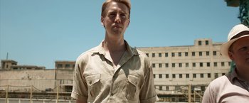 Movie still from “Kon-Tiki” (2012), directed by Espen Sandberg – A man with blonde hair wearing a tan shirt; Medium shot, Low angle