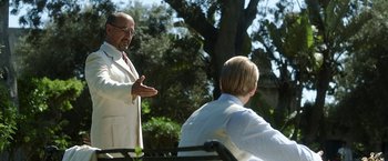 Movie still from “Kon-Tiki” (2012), directed by Espen Sandberg – A man in a white suit is talking to another man in a white suit; Medium shot, Over the shoulder angle