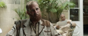 Movie still from “Kon-Tiki” (2012), directed by Espen Sandberg – A man with a long beard is looking at the camera; Close Up shot, Over the shoulder angle