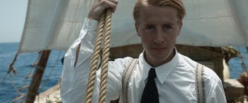 Movie still from “Kon-Tiki” (2012), directed by Espen Sandberg – A man holding on to a large rope; Close Up shot, Low angle