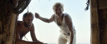 Movie still from “Kon-Tiki” (2012), directed by Espen Sandberg – A man with blond hair is holding a string; Medium shot, Low angle