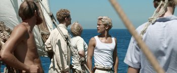 Movie still from “Kon-Tiki” (2012), directed by Espen Sandberg – A group of men standing on top of a boat; Medium shot, Low angle