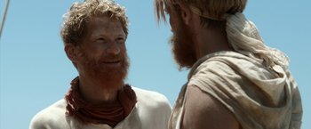 Movie still from “Kon-Tiki” (2012), directed by Espen Sandberg – A man with red hair and a beard talking to another man with red hair and a beard; Close Up shot, Over the shoulder angle