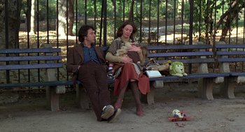 Movie still from “Kramer vs. Kramer” (1979), directed by Robert Benton – A man and a woman sitting on a park bench; Wide shot, High angle