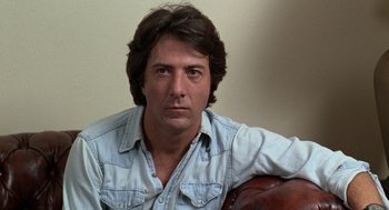 Movie still from “Kramer vs. Kramer” (1979), directed by Robert Benton – A person sitting on a chair; Close Up shot, Low angle