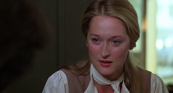 Movie still from “Kramer vs. Kramer” (1979), directed by Robert Benton – A person with long hair; Close Up shot, Over the shoulder angle