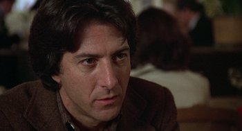Movie still from “Kramer vs. Kramer” (1979), directed by Robert Benton – A person sitting in a room; Close Up shot, Over the shoulder angle