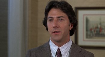 Movie still from “Kramer vs. Kramer” (1979), directed by Robert Benton – A person wearing a suit and tie; Close Up shot, Low angle