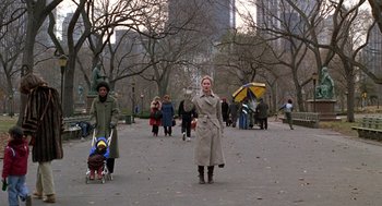 Movie still from “Kramer vs. Kramer” (1979), directed by Robert Benton – A group of people walking down a sidewalk; Wide shot, Over the shoulder angle