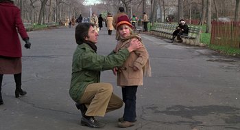 Movie still from “Kramer vs. Kramer” (1979), directed by Robert Benton – A woman helping a young girl put on a jacket; Medium shot, Over the shoulder angle