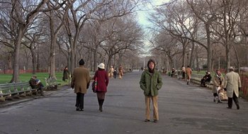 Movie still from “Kramer vs. Kramer” (1979), directed by Robert Benton – A group of people walking down a sidewalk; Wide shot, Over the shoulder angle