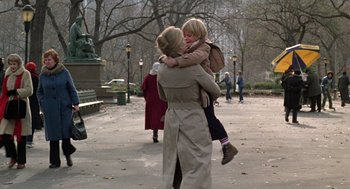 Movie still from “Kramer vs. Kramer” (1979), directed by Robert Benton – A woman holding a child in her arms; Wide shot, Over the shoulder angle