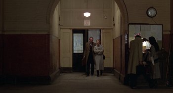 Movie still from “Kramer vs. Kramer” (1979), directed by Robert Benton – A man and a woman are standing in an entrance way; Wide shot, High angle