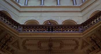 Movie still from “Kramer vs. Kramer” (1979), directed by Robert Benton – A man standing on the balcony of an old building; Extreme Wide shot, Low angle