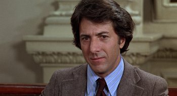 Movie still from “Kramer vs. Kramer” (1979), directed by Robert Benton – A person wearing a suit and tie; Close Up shot, Low angle
