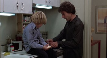 Movie still from “Kramer vs. Kramer” (1979), directed by Robert Benton – A man and a boy in a room; Medium shot, Low angle
