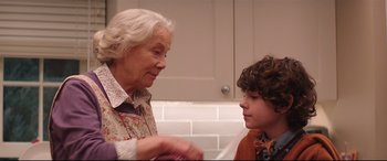 Movie still from “Krampus” (2015), directed by Michael Dougherty – An older woman and a young boy in a kitchen; Close Up shot, Over the shoulder angle