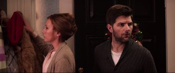 Movie still from “Krampus” (2015), directed by Michael Dougherty – A man and a woman standing next to each other; Close Up shot, Over the shoulder angle