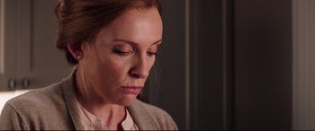 Movie still from “Krampus” (2015), directed by Michael Dougherty – A person with her eyes closed; Close Up shot, Over the shoulder angle