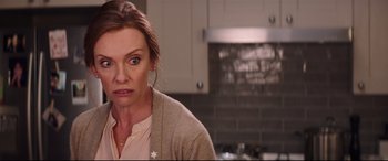 Movie still from “Krampus” (2015), directed by Michael Dougherty – A person in a kitchen; Close Up shot, Over the shoulder angle