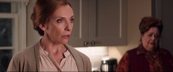 Movie still from “Krampus” (2015), directed by Michael Dougherty – A person standing in a kitchen; Close Up shot, Over the shoulder angle