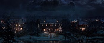 Movie still from “Krampus” (2015), directed by Michael Dougherty – A large house with christmas lights on the front yard; Extreme Wide shot, High angle