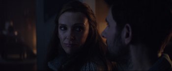 Movie still from “Krampus” (2015), directed by Michael Dougherty – A man and a woman looking at each other in the dark; Close Up shot, Over the shoulder angle