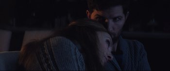 Movie still from “Krampus” (2015), directed by Michael Dougherty – A man and a woman looking at each other in the dark; Close Up shot, Over the shoulder angle