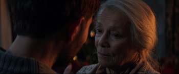 Movie still from “Krampus” (2015), directed by Michael Dougherty – An older woman and a younger man are looking at each other; Close Up shot, Over the shoulder angle