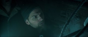 Movie still from “Krampus” (2015), directed by Michael Dougherty – A person wearing a hat; Close Up shot, Low angle