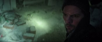 Movie still from “Krampus” (2015), directed by Michael Dougherty – A person in a dark room; Close Up shot, Low angle