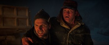 Movie still from “Krampus” (2015), directed by Michael Dougherty – Two men in the dark with one of them holding a knife; Close Up shot, Low angle