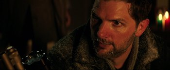 Movie still from “Krampus” (2015), directed by Michael Dougherty – A person wearing a jacket; Close Up shot, Over the shoulder angle