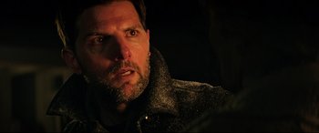 Movie still from “Krampus” (2015), directed by Michael Dougherty – A person wearing a jacket; Close Up shot, Over the shoulder angle