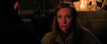 Movie still from “Krampus” (2015), directed by Michael Dougherty – A person with long brown hair; Close Up shot, Over the shoulder angle