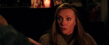 Movie still from “Krampus” (2015), directed by Michael Dougherty – A person with long hair; Close Up shot, Over the shoulder angle