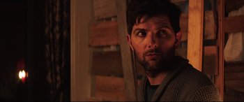 Movie still from “Krampus” (2015), directed by Michael Dougherty – A person looking at the camera; Close Up shot, Over the shoulder angle