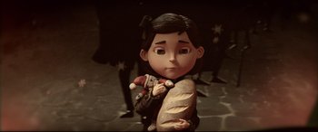 Movie still from “Krampus” (2015), directed by Michael Dougherty – A doll holding a loaf of bread; Close Up shot, Over the shoulder angle